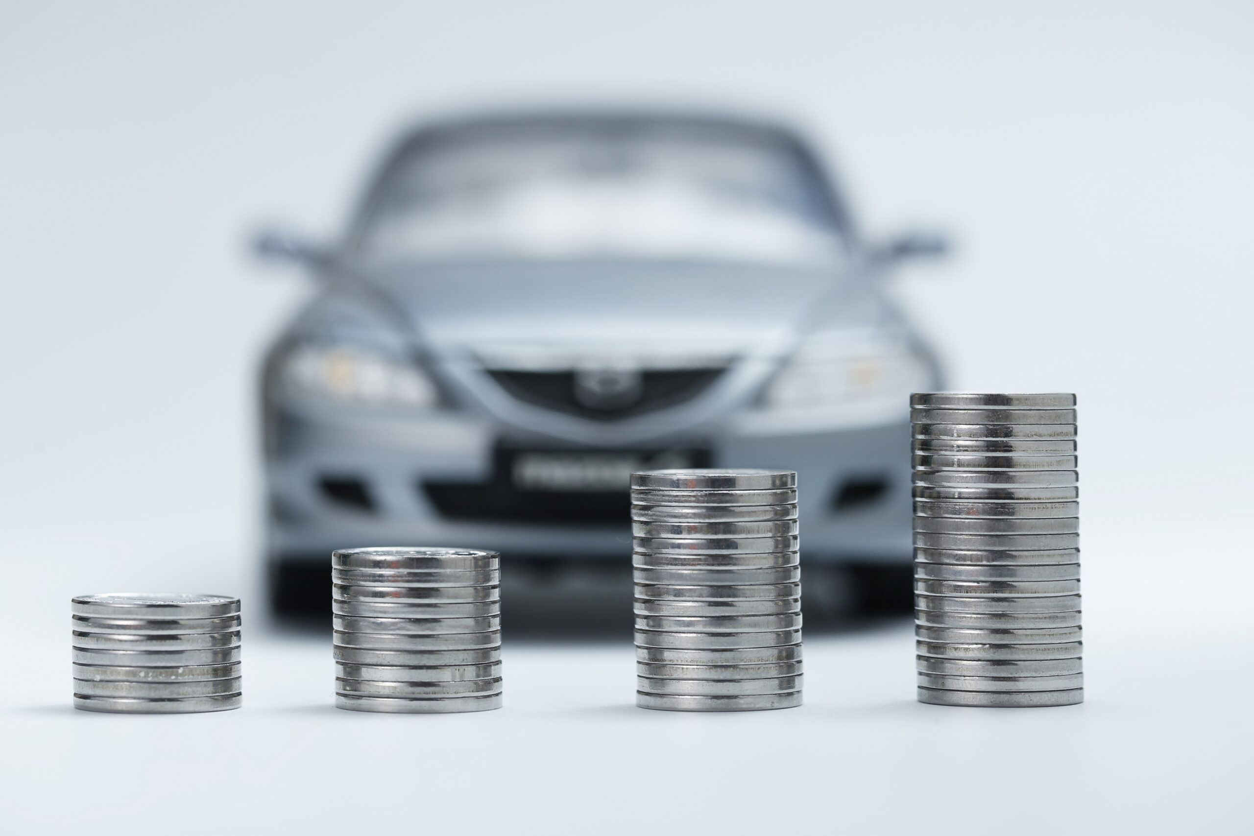Picture of a car behind some coin