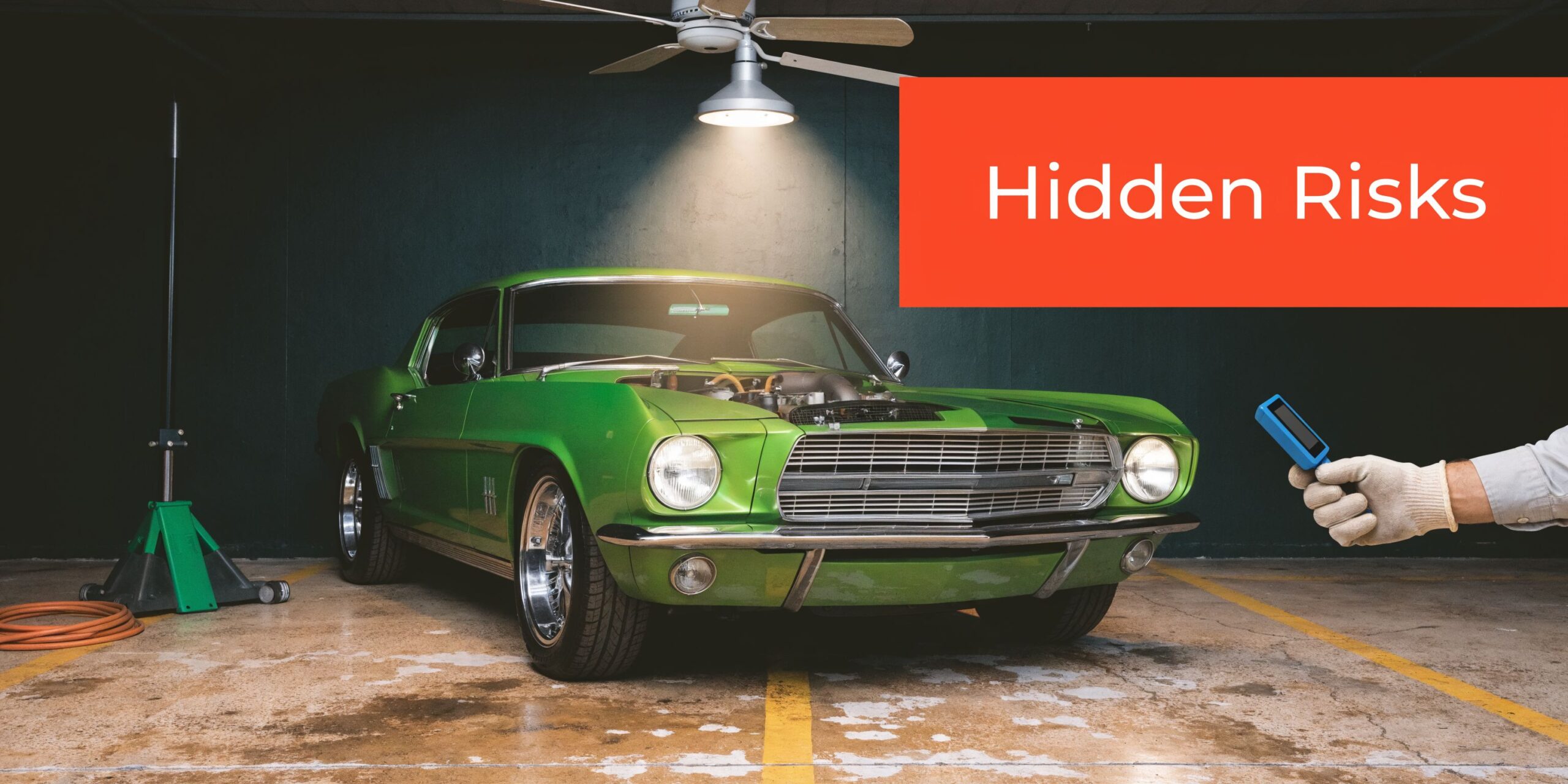 A professional car inspector uses a digital diagnostic tool to examine a vintage green muscle car.